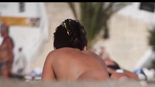 Hot Nudist Girl Topless showing boobs on nude beach 259