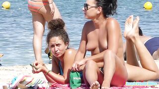 Hot Nudist Girl Topless showing boobs on nude beach 50