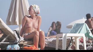 Hot Nudist Girl Topless showing boobs on nude beach 196