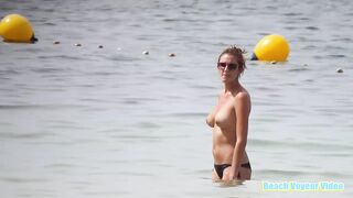 Hot Nudist Girl Topless showing boobs on nude beach 75