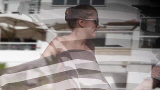 Hot Nudist Girl Topless showing boobs on nude beach 241