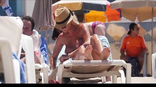 Hot Nudist Girl Topless showing boobs on nude beach 219