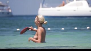 Hot Nudist Girl Topless showing boobs on nude beach 219