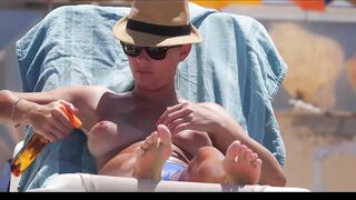 Hot Nudist Girl Topless showing boobs on nude beach 219