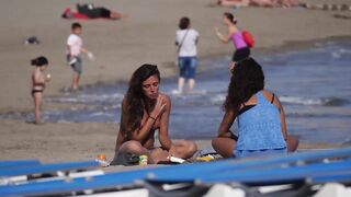 Hot Nudist Girl Topless showing boobs on nude beach 171