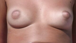 Hot Nudist Girl Topless showing boobs on nude beach 429