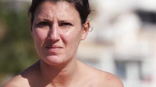 Hot Nudist Girl Topless showing boobs on nude beach 239