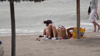 Hot Nudist Girl Topless showing boobs on nude beach 249