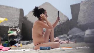 Hot Nudist Girl Topless showing boobs on nude beach 250
