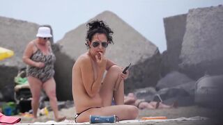 Hot Nudist Girl Topless showing boobs on nude beach 250