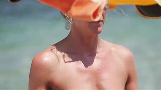 Hot Nudist Girl Topless showing boobs on nude beach 245