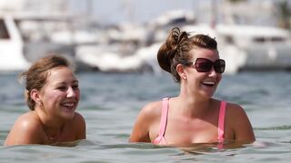 Sexy Nudist Babe Topless showing tits on nude beach 875