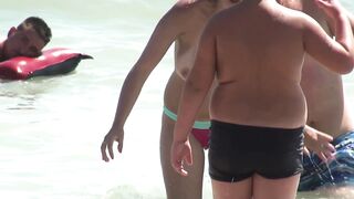 Sexy Nudist Babe Topless showing tits on nude beach 952