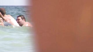 Sexy Nudist Babe Topless showing tits on nude beach 947