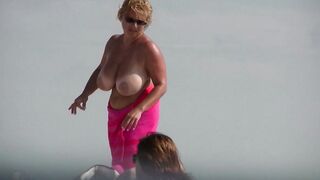 Sexy Nudist Babe Topless showing tits on nude beach 936