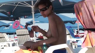 Sexy Nudist Babe Topless showing tits on nude beach 948