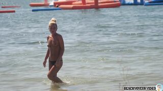 Sexy Nudist Babe Topless showing tits on nude beach 893