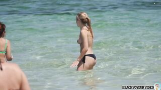 Sexy Nudist Babe Topless showing tits on nude beach 881