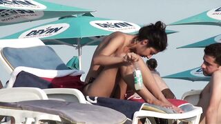 Sexy Nudist Babe Topless showing tits on nude beach 937