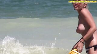 Sexy Nudist Babe Topless showing tits on nude beach 903