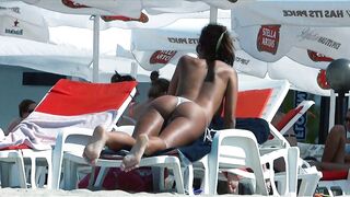 Sexy Nudist Babe Topless showing tits on nude beach 968