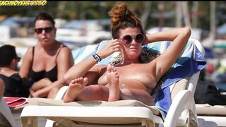 Sexy Nudist Babe Topless showing tits on nude beach 911