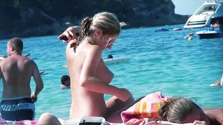 Sexy Nudist Babe Topless showing tits on nude beach 967