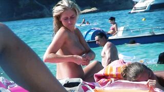 Sexy Nudist Babe Topless showing tits on nude beach 967