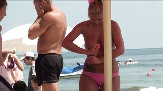 Sexy Nudist Babe Topless showing tits on nude beach 982