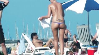 Sexy Nudist Babe Topless showing tits on nude beach 979