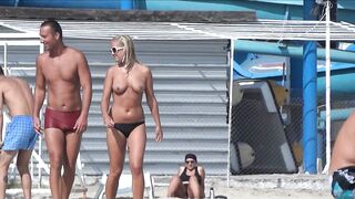 Sexy Nudist Babe Topless showing tits on nude beach 986