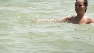 Sexy Nudist Babe Topless showing tits on nude beach 984