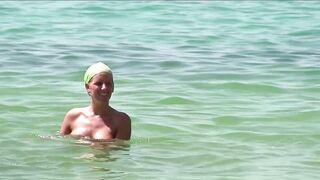 Sexy Nudist Babe Topless showing tits on nude beach 992