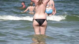 Sexy Nudist Babe Topless showing tits on nude beach 1026