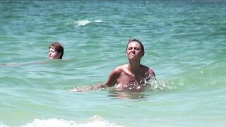 Sexy Nudist Babe Topless showing tits on nude beach 1016