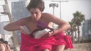 Sexy Nudist Babe Topless showing tits on nude beach 1051