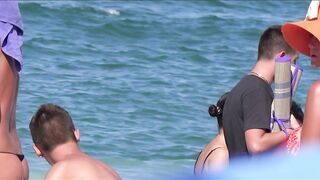 Sexy Nudist Babe Topless showing tits on nude beach 1050