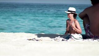 Sexy Nudist Babe Topless showing tits on nude beach 996