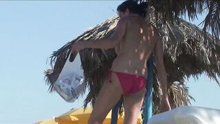 Sexy Nudist Babe Topless showing tits on nude beach 1036