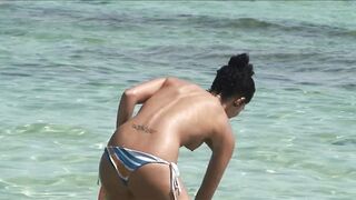 Sexy Nudist Babe Topless showing tits on nude beach 1049