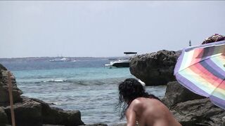 Sexy Nudist Babe Topless showing tits on nude beach 990