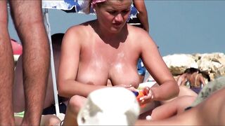 Sexy Nudist Babe Topless showing tits on nude beach 1002