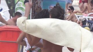 Sexy Nudist Babe Topless showing tits on nude beach 1048