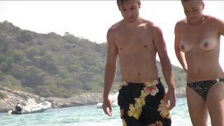 Sexy Nudist Babe Topless showing tits on nude beach 1048