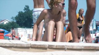 Sexy Nudist Babe Topless showing tits on nude beach 962