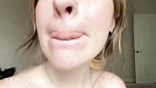Elfbxby is licking her fingers and showing her face without cosmetic