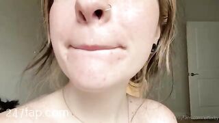 Elfbxby is licking her fingers and showing her face without cosmetic